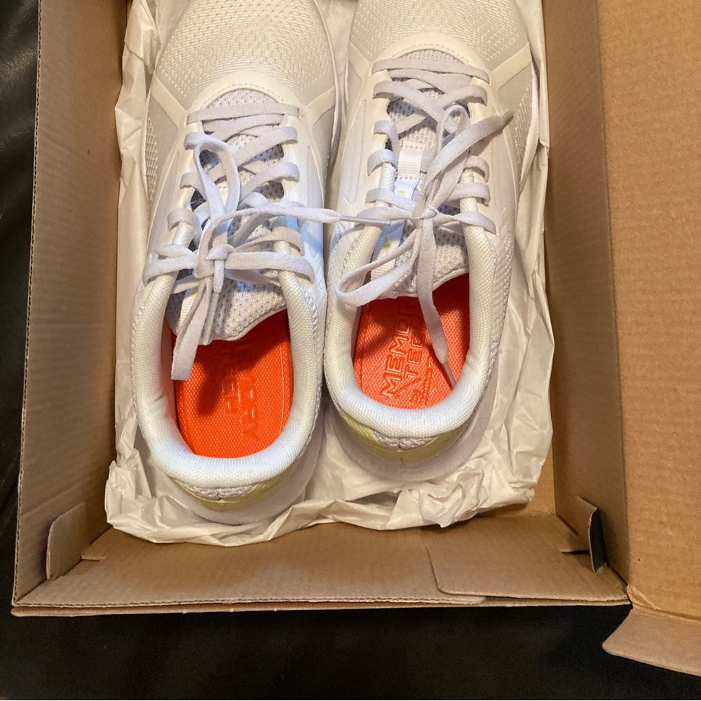 Reebok size 8.5 white with yellow bands at the back